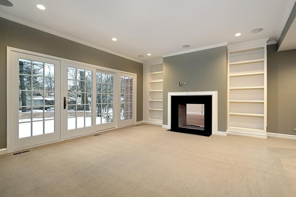 Photo ready living room with clean carpet and built-in shelves, pre-listing cleaning in Denver Metro